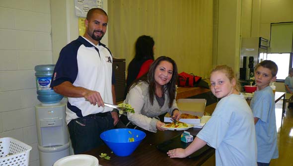 Enrica Uva and Shea Emery cook up a storm at St. Gabriel School. (Photo courtesy of Generations Foundation)