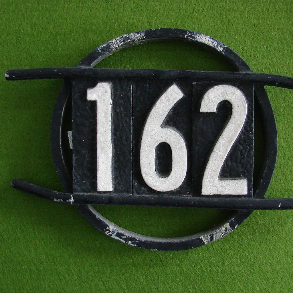 House address number. Photo by Abbey Hendrickson, via Wikimedia Commons