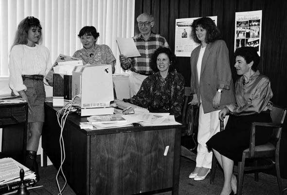 Senior Times staffers gather around their giant computer deep in the 1980s.